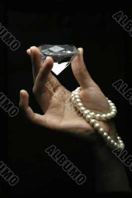 Female hand holding diamond