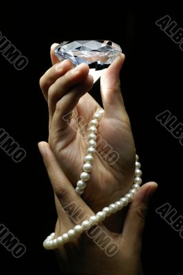 Female hands holding diamond