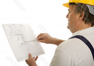 Construction worker with plan of an architect