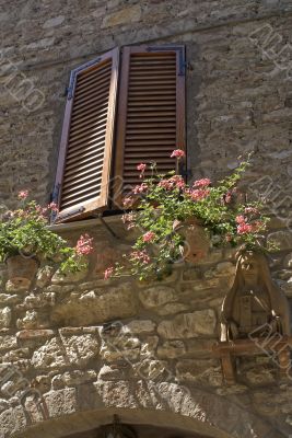 Corciano (Perugia) - Closed window, flowers, and terracotta stat