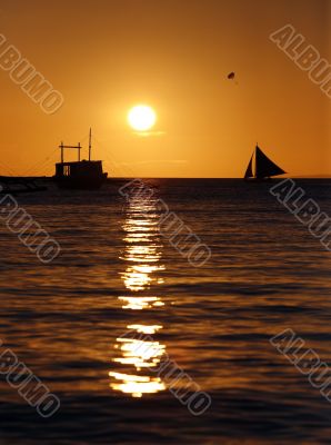 Drifting boat on a sunset