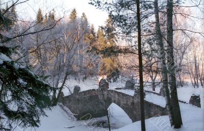 Old stone bridge in winter park