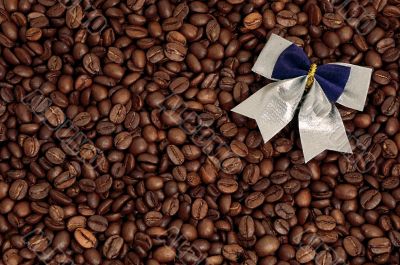 Coffee beans background and a bow