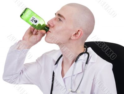 Man in doctor`s smock with green bottle