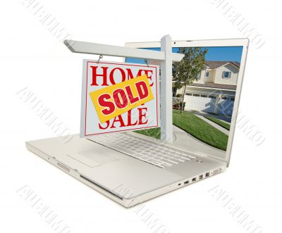 Sold Home for Sale Sign & New House on Laptop
