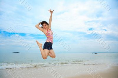 happy fun jump at the beach