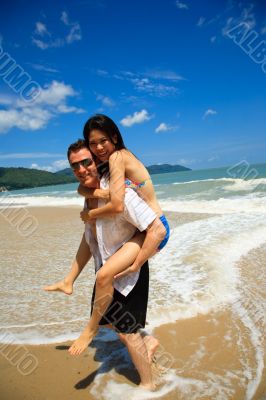 happy couple at the beach