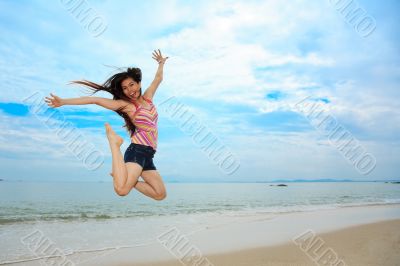 happy fun jump at the beach