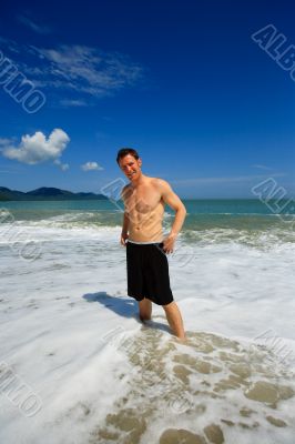 Man standing on exotic beach