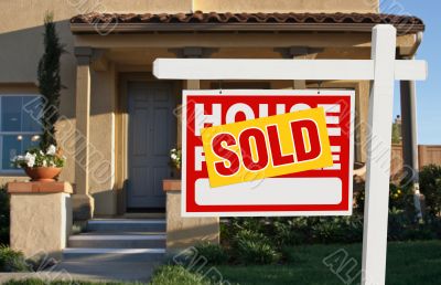 Sold Home For Sale Sign and House
