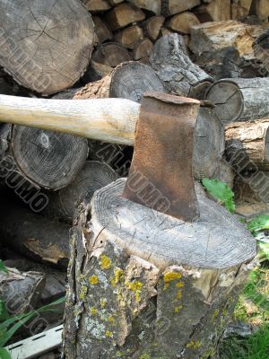 axe on a piece of wood