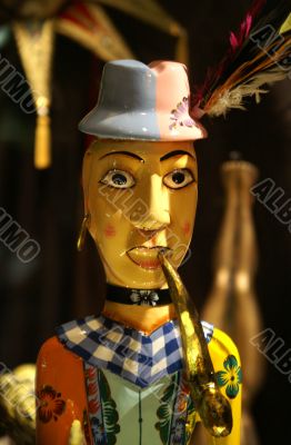 Wooden doll with a pipe