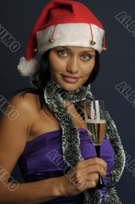 beautiful woman drinking champagne into Christmas