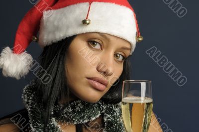 beautiful woman drinking champagne into Christmas