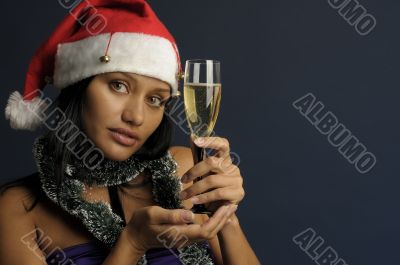 beautiful woman drinking champagne into Christmas