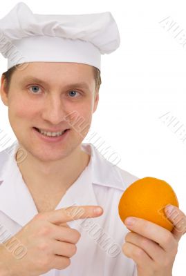 Cook with orange in hand