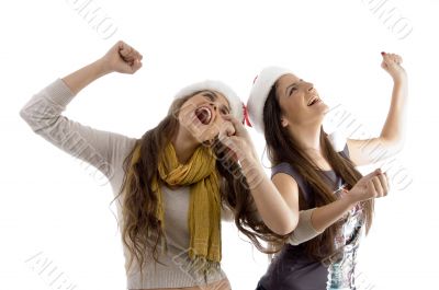 women in christmas hats enjoying