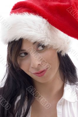 close up of woman wearing christmas hat