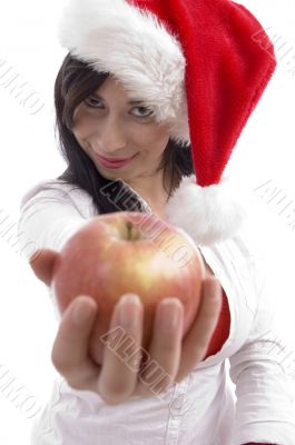 sexy model with christmas hat showing apple