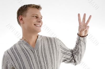 man with counting hand gesture