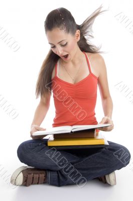 surprised student looking into book