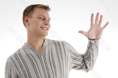 young man with counting hand gesture
