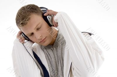 young handsome man enjoying music with headphones