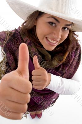 smiling female showing thumbs up