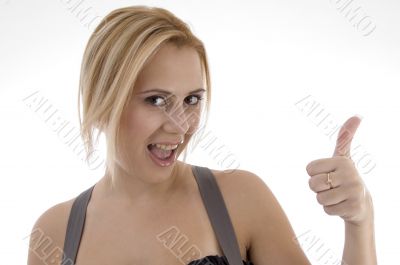 smiling woman showing thumbs up
