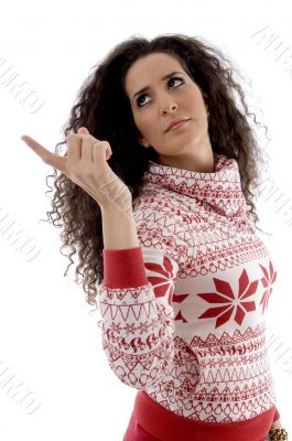 young woman pointing aside