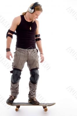 young male model skating on the floor