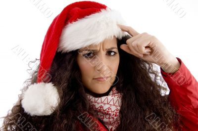 thinking young woman with christmas hat