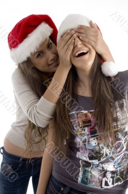 sisters in christmas hat playing