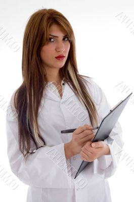 pretty doctor posing with writing board
