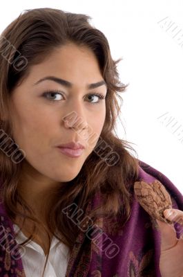 beautiful female eating cookies