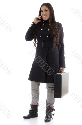 smart model busy on call and holding leather bag