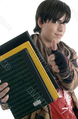 young student posing with books