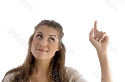 close up view of beautiful woman pointing upwards