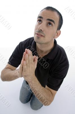 handsome young man posing with joined hands