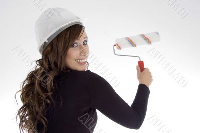 woman with architect helmet and paint brush