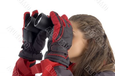 american woman looking through binoculars
