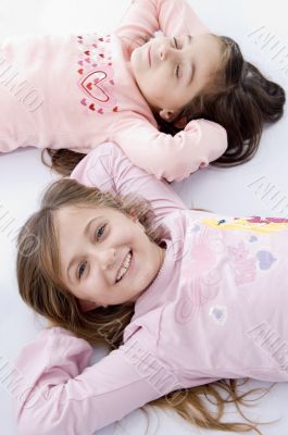 sweet little laying sisters