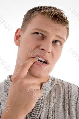 thinking man putting his finger in mouth