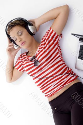 laying woman listening music