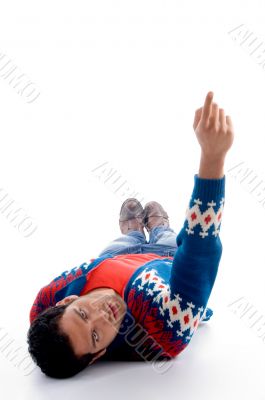 laying handsome young man pointing upward