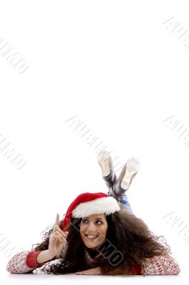 pointing female with christmas hat