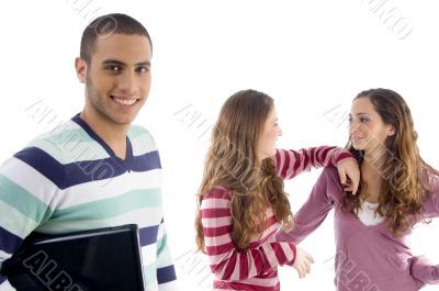 two girls holding to each other and guy