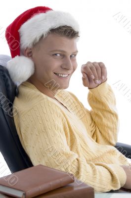 handsome male wearing santa hat looking at camera