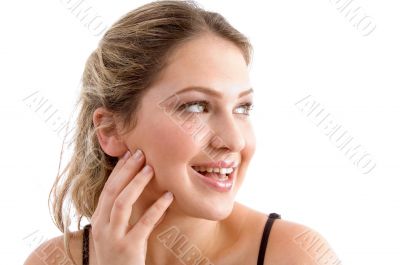 beautiful young woman smiling and looking sideways