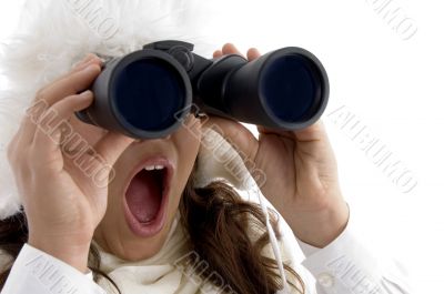 beautiful woman looking through binocular